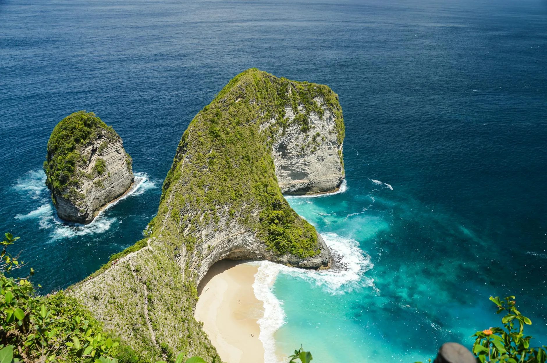 Turquoise waters lapping white sand shores of a serene, crowd-free Asian tropical island