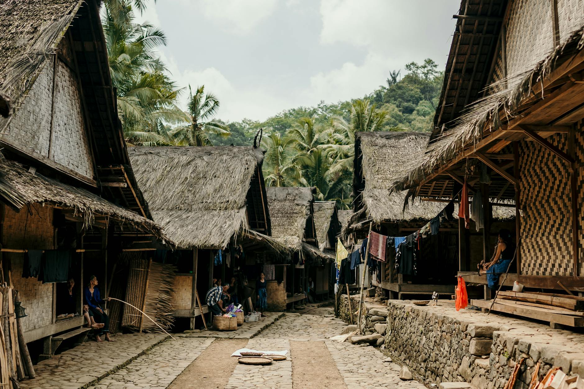 Locals guiding tourists through a vibrant village market, sharing culture and traditions