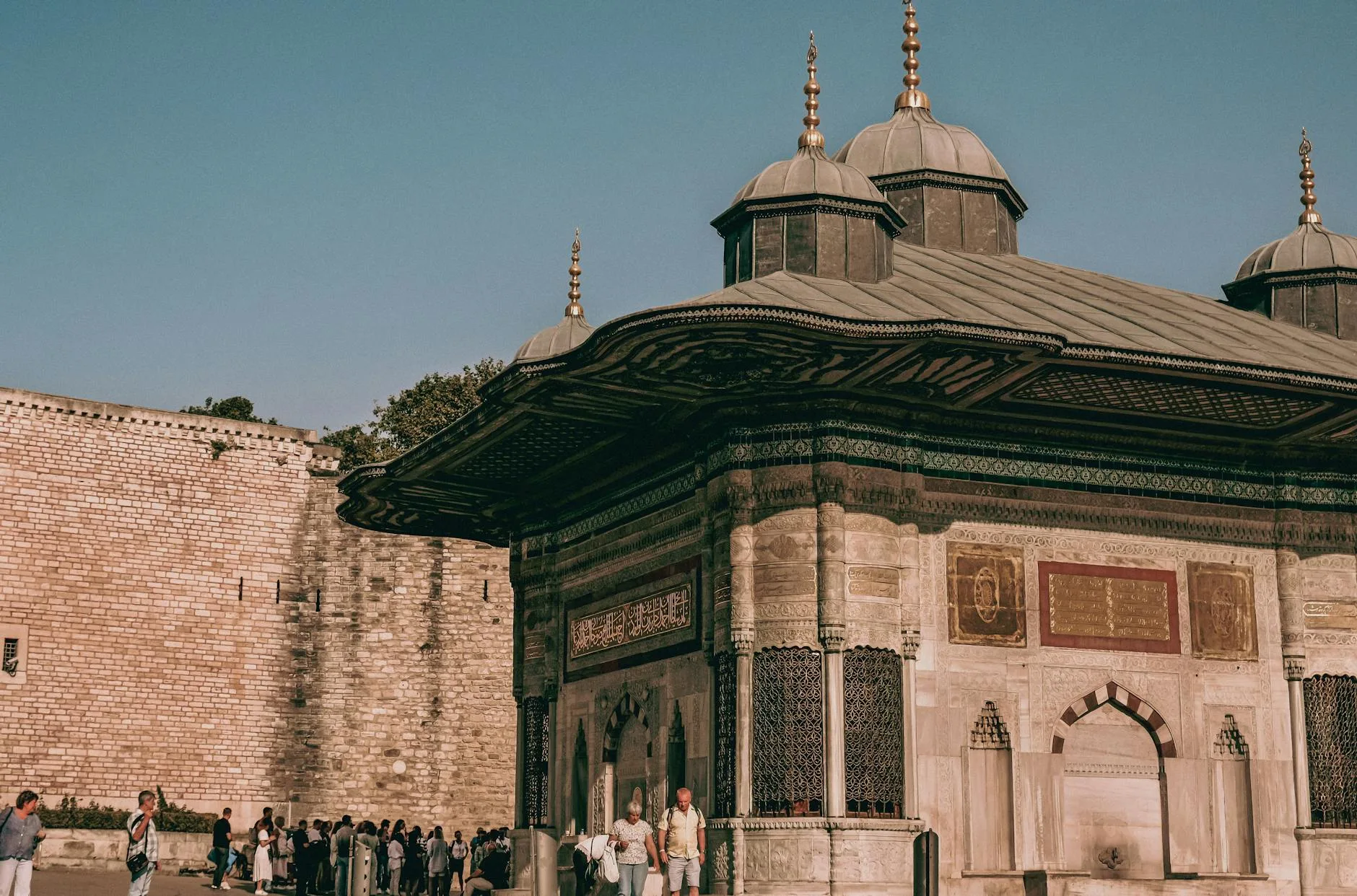Hagia Sophia's golden domes rising over Istanbul's skyline at sunset