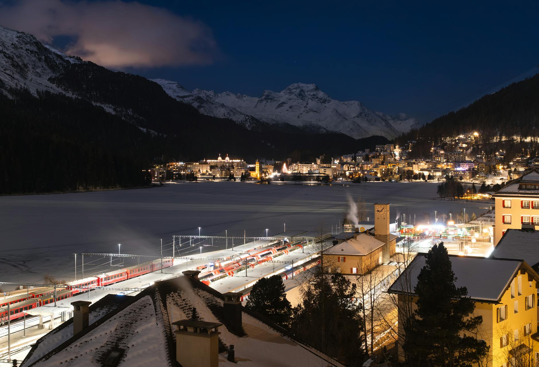 Moonlit European night train gliding through misty mountains under a starry sky