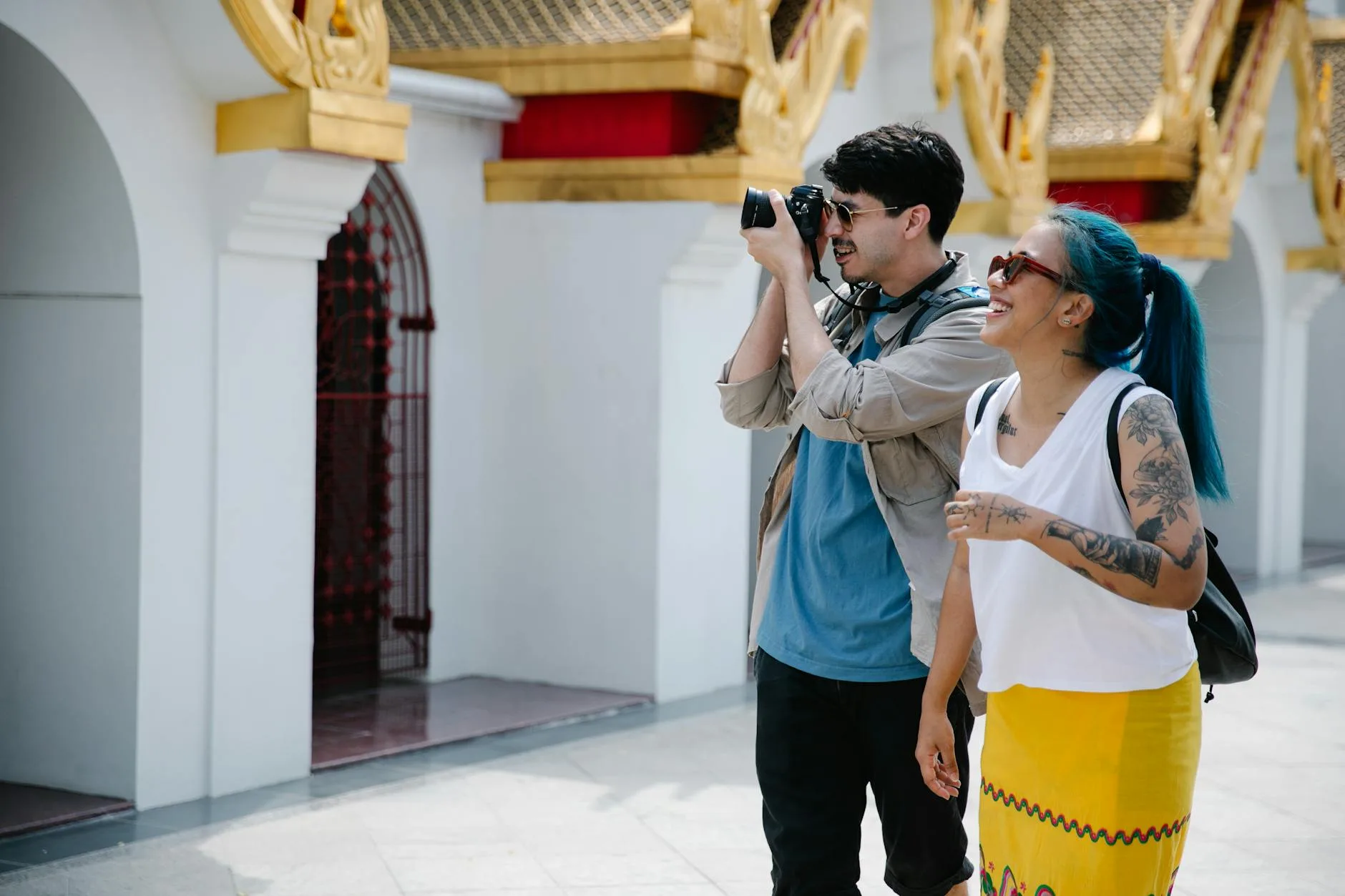 Traveler respectfully photographing a colorful local market with permission in Southeast Asia