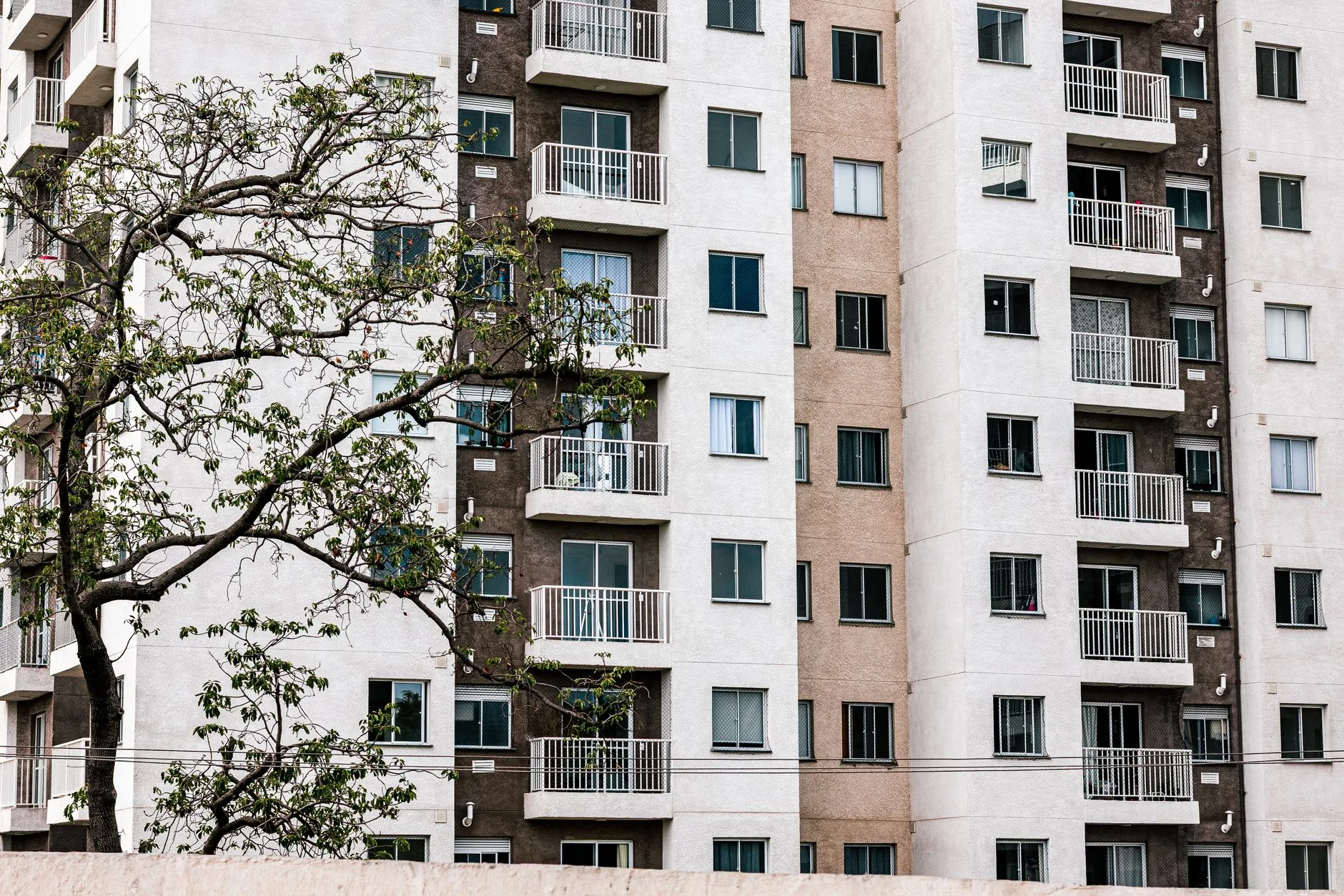Cozy furnished apartment with city view, suitcase by the door, ready for a month abroad