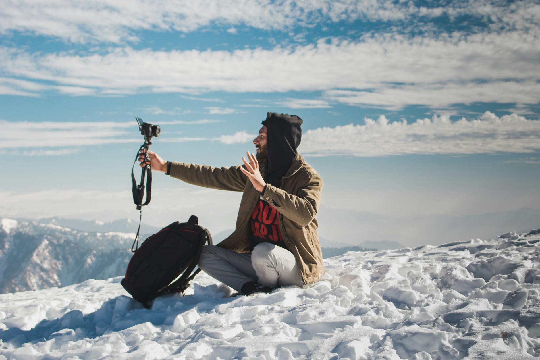 Lone traveler on a winding mountain road through Pakistan's dramatic Karakoram peaks