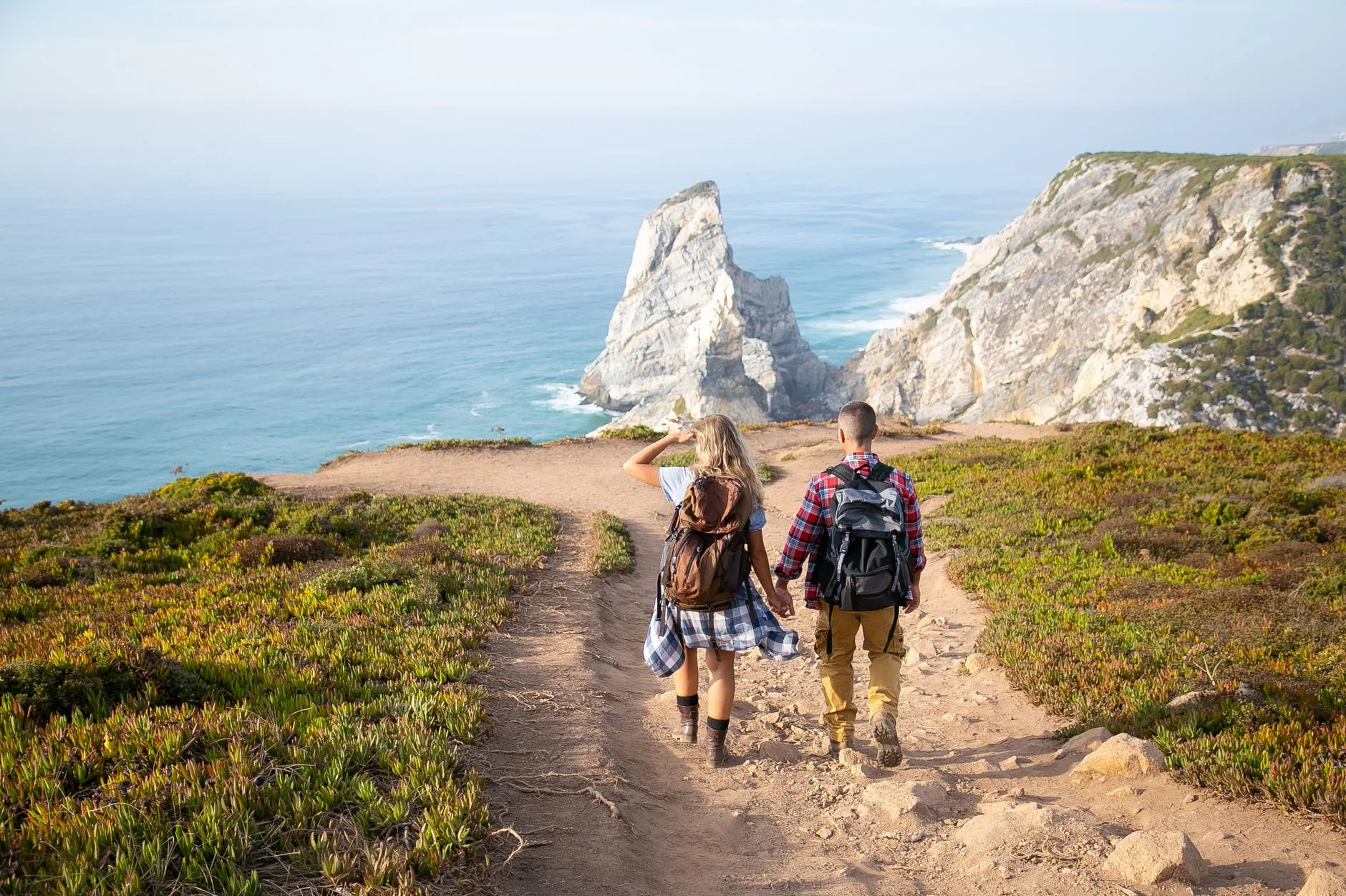 Dusty backpacker trails winding through Portugal's sun-baked villages and rolling green hills