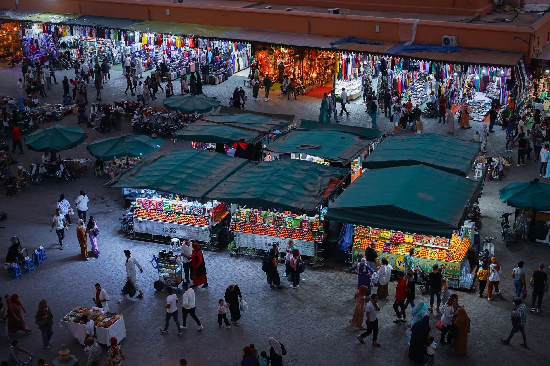 Colorful Marrakech medina street with lanterns, spices, and bustling market stalls