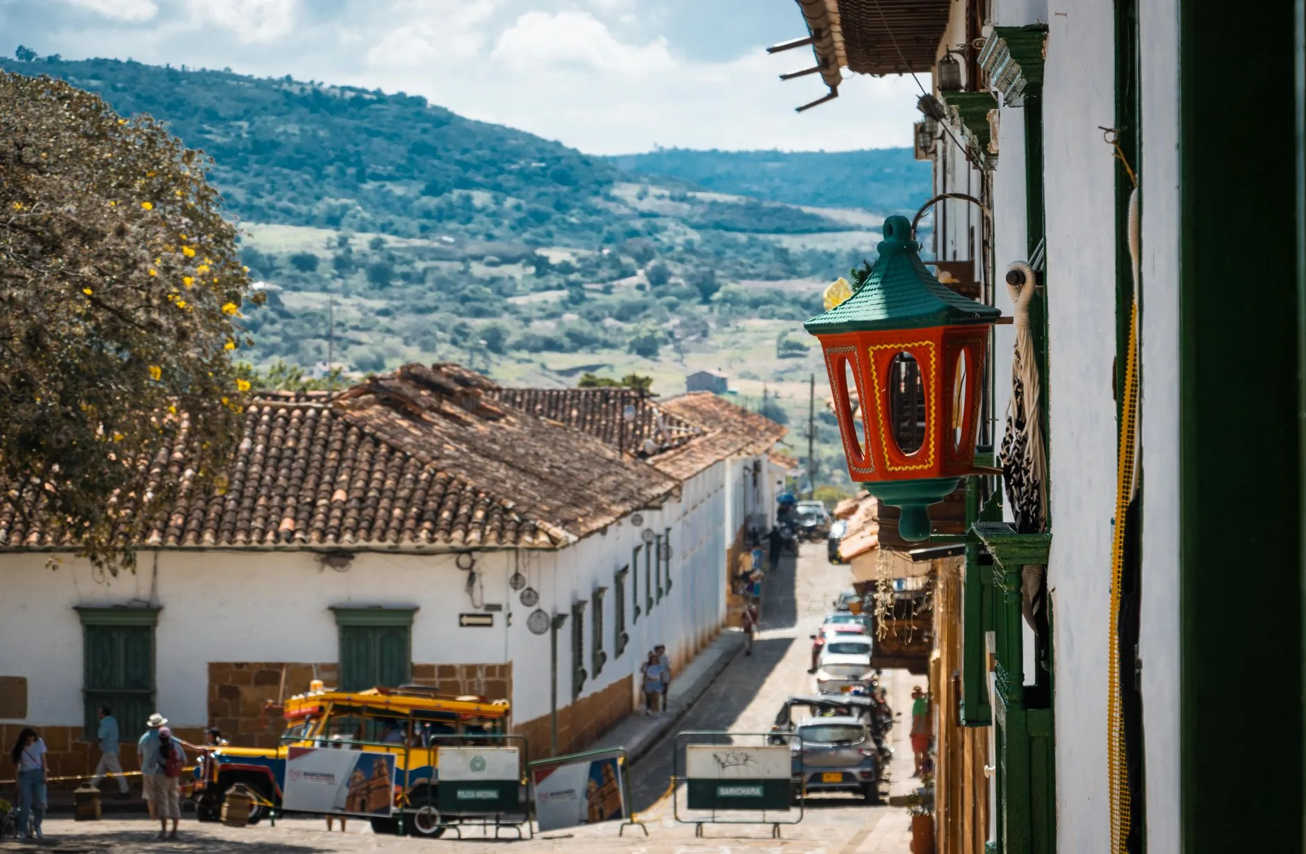 Colorful colonial buildings lining a cobblestone street in Cartagena, Colombia