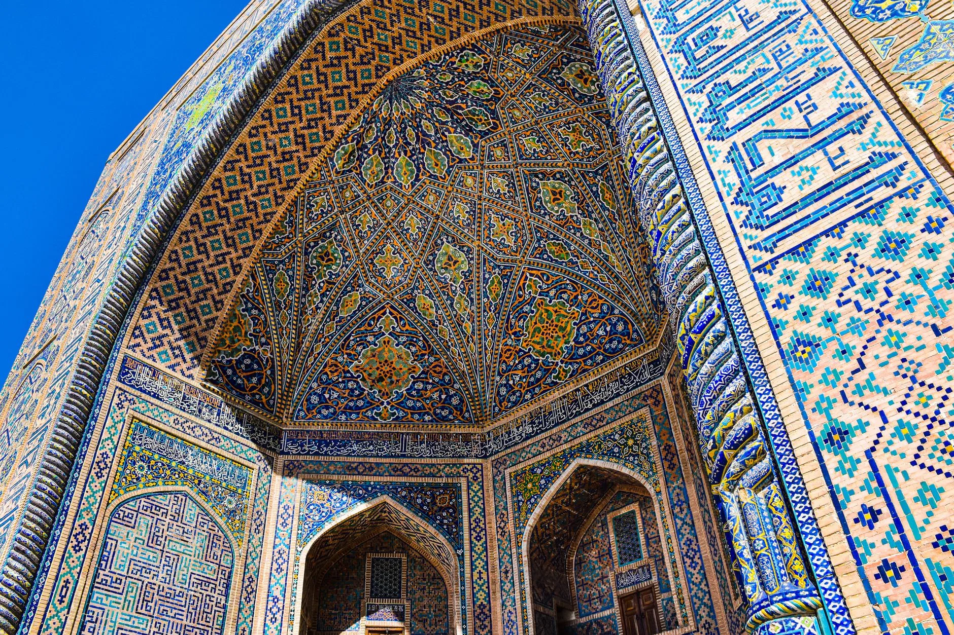 Sunlit Registan Square domes and minarets shimmering in Samarkand, Uzbekistan