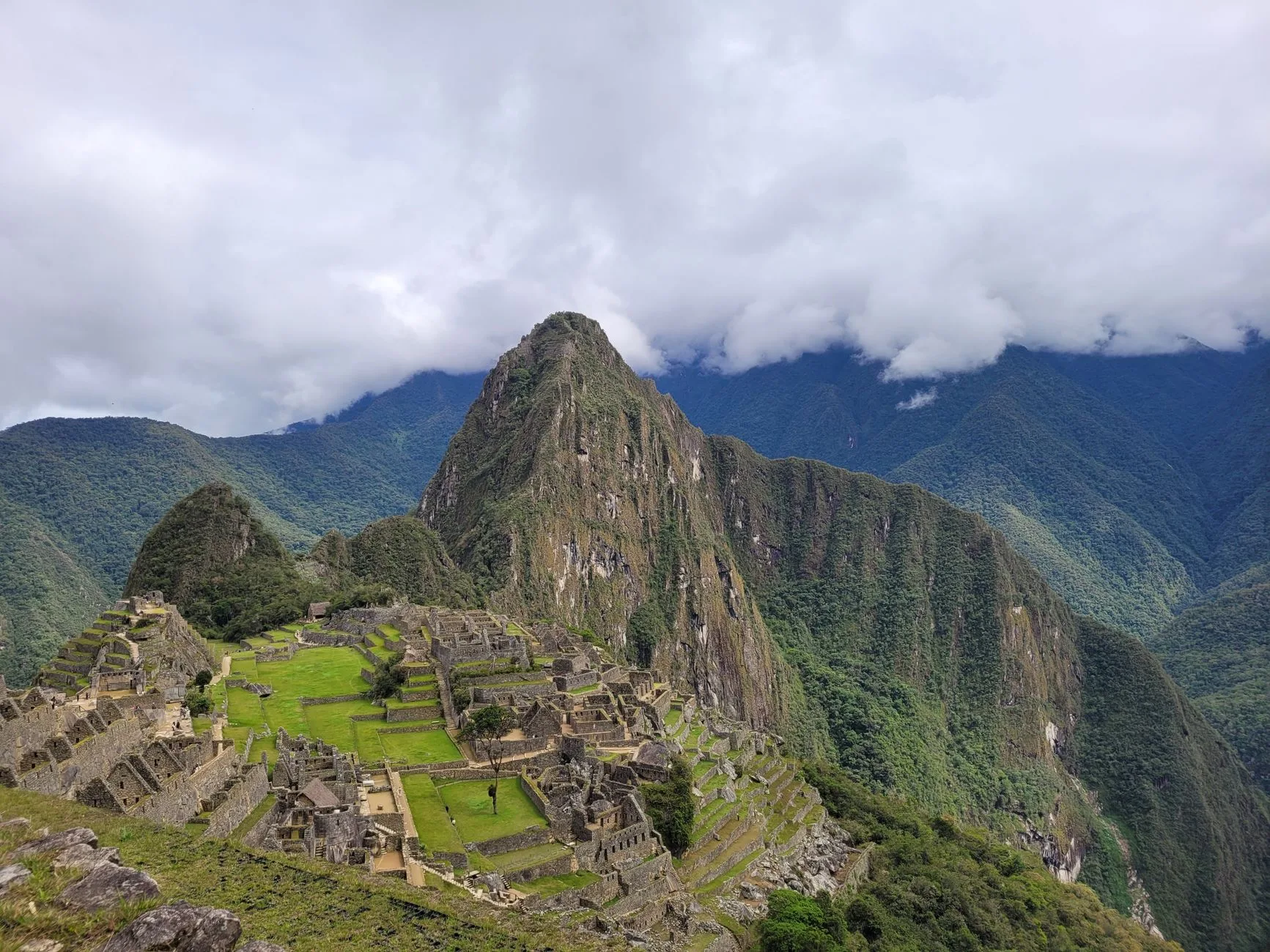 Colorful Andean mountains and traditional textiles reflect Peru's budget-friendly hidden gems