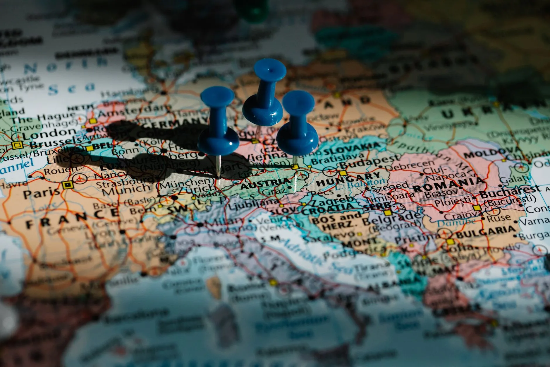 World map with passport, boarding passes, and pinned travel route across multiple countries