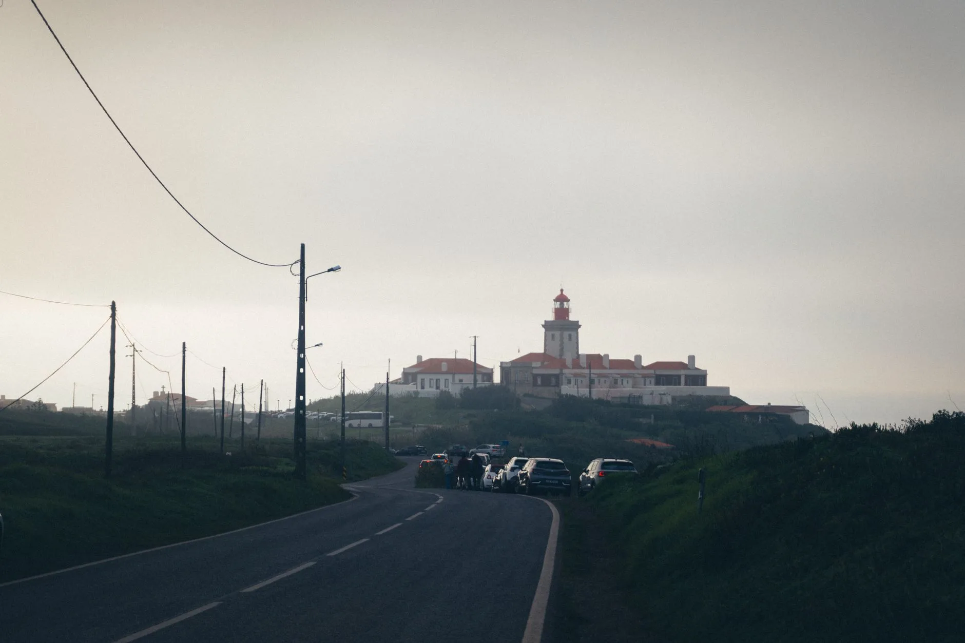Coastal highway winding along Atlantic cliffs between Portugal and Spain at sunset