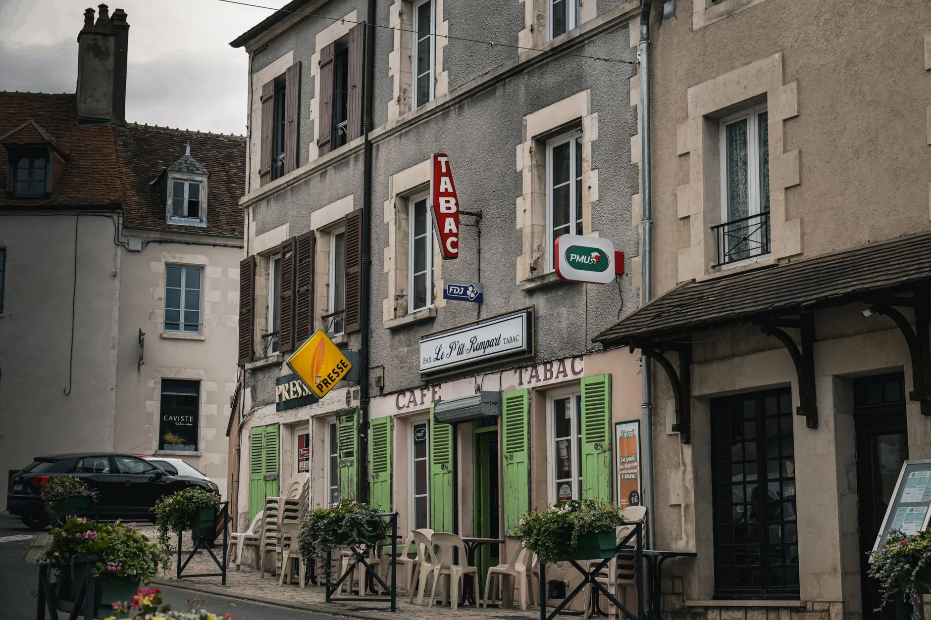 Sunlit French countryside with stone farmhouse, lavender fields, and rustic market stall