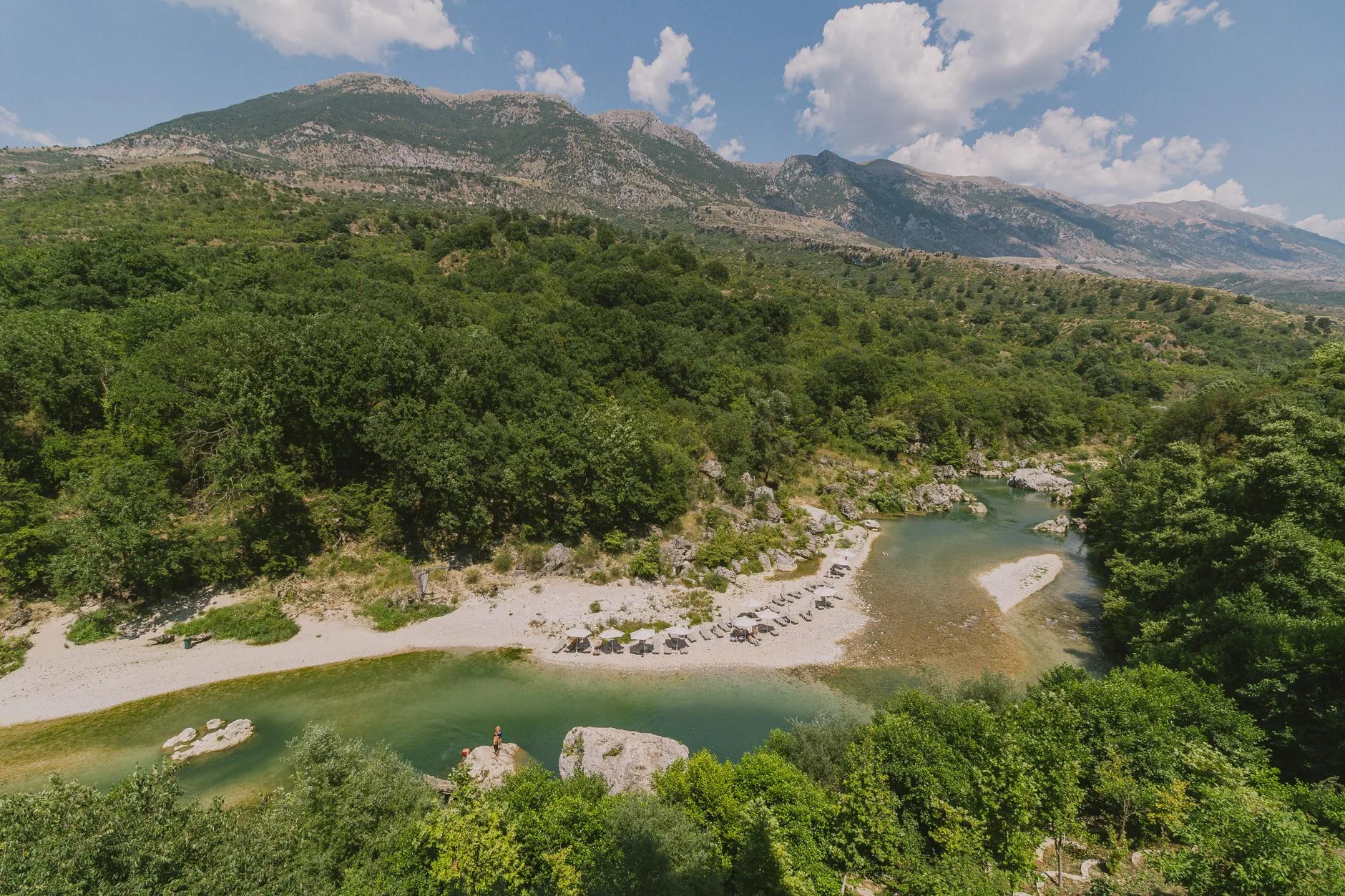 Coastal cliffs and turquoise waters along Albania's rugged Ionian Sea shoreline